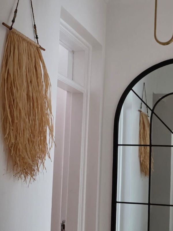 Raffia Bunting Wall Hanging on display by Lucidity Artisanals